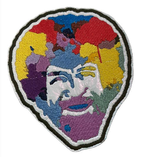 Handmade colorful TV artist iron-on patch on white holographic background.