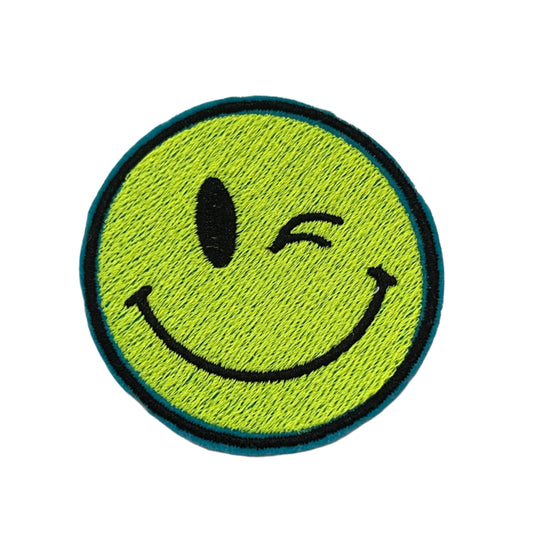 Winking smiley face iron-on patch with retro charm and modern twist.