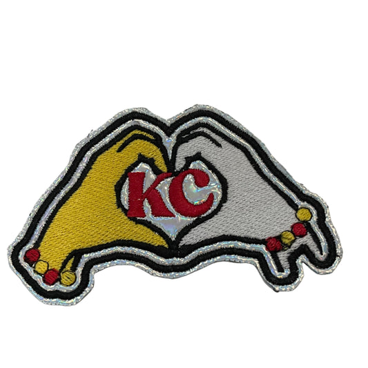 Handmade KC Heart Hands Iron-On Patch with red, yellow, and white embroidery forming a heart shape with "KC" letters.