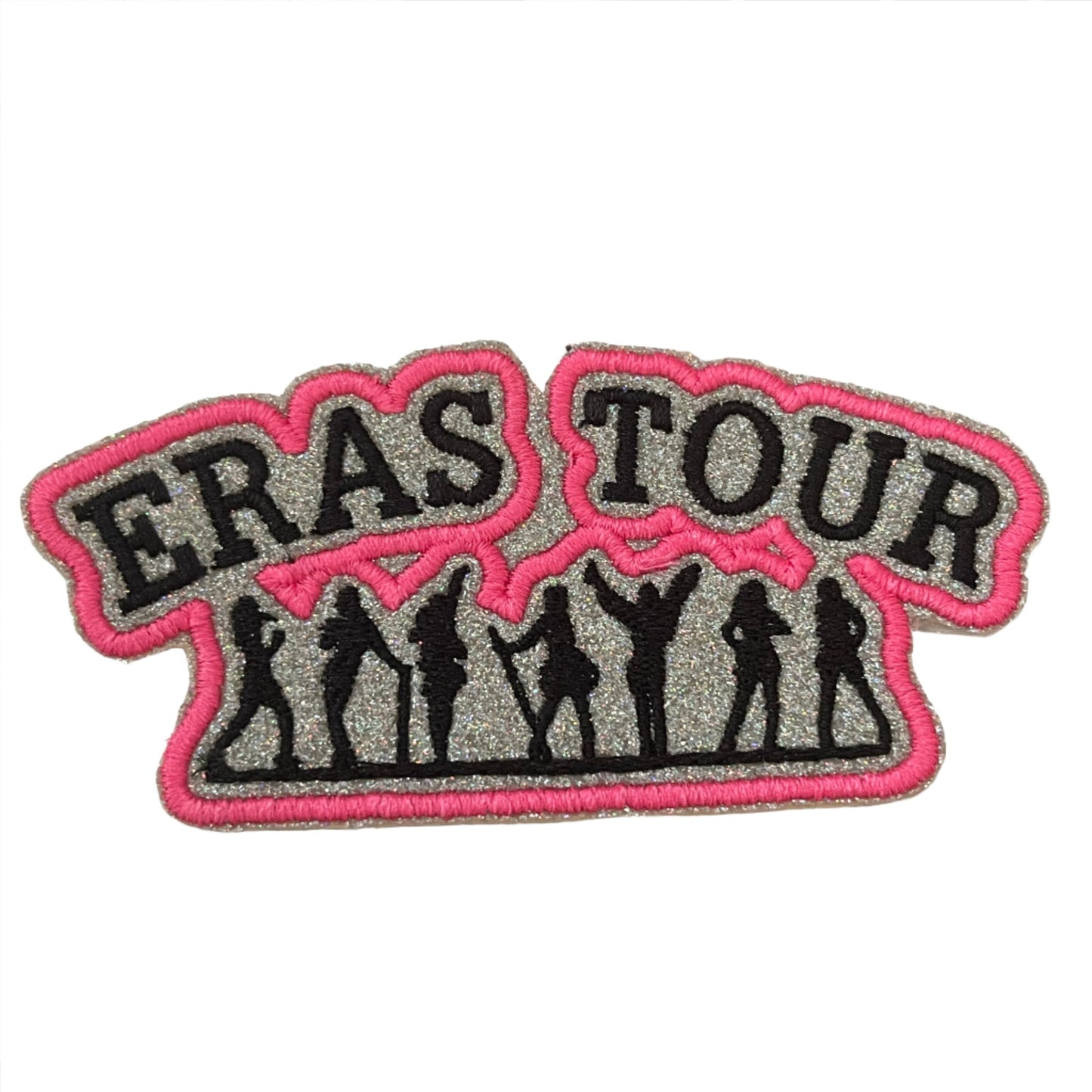 Eras Tour iron-on patch featuring silhouettes of Taylor Swift's eras with bold "ERAS TOUR" text in pink.