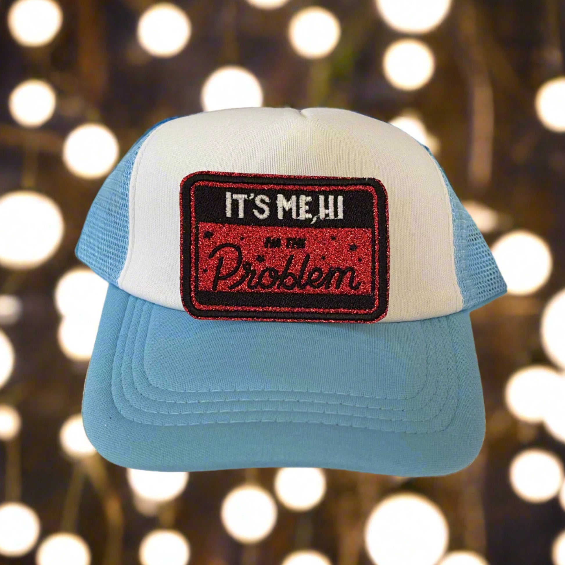 Iron-on patch featuring the text "It's Me, Hi, I'm the Problem" from Taylor Swift's song "Anti-Hero" in a bold and playful design, showcasing a stylish and humorous aesthetic.