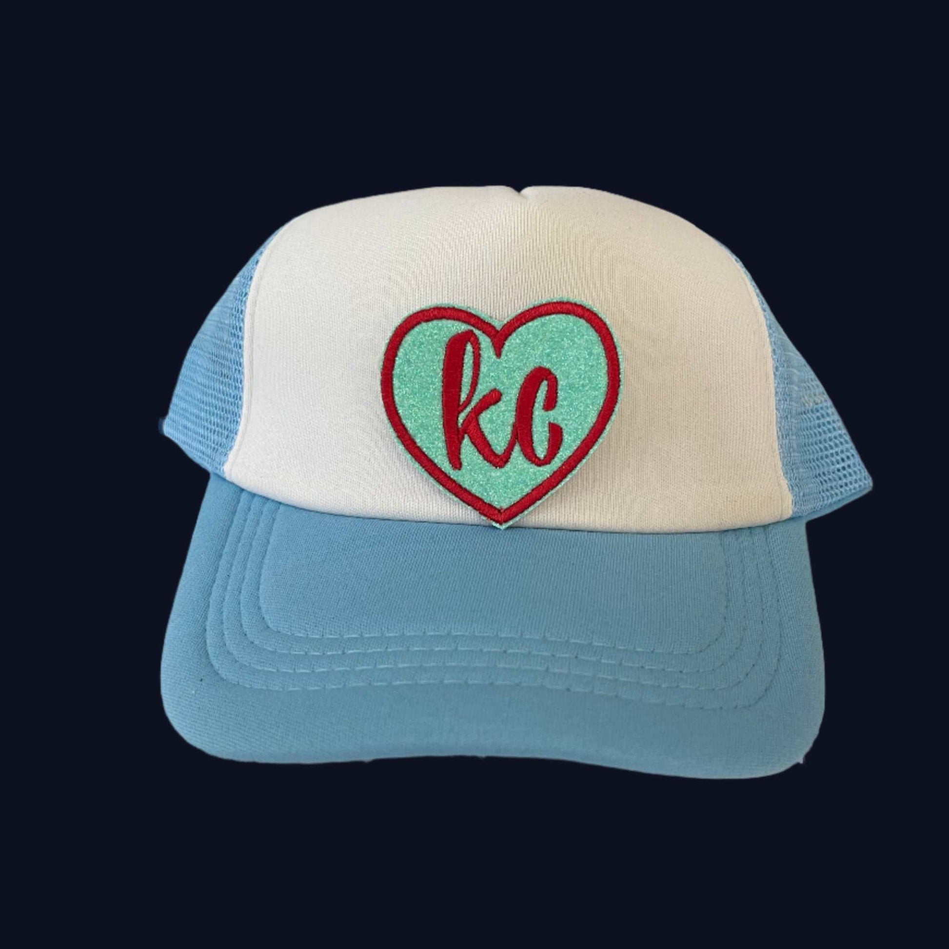 Iron-on patch featuring a heart design with "kc" in vibrant KC Current colors, showcasing a stylish and retro aesthetic.