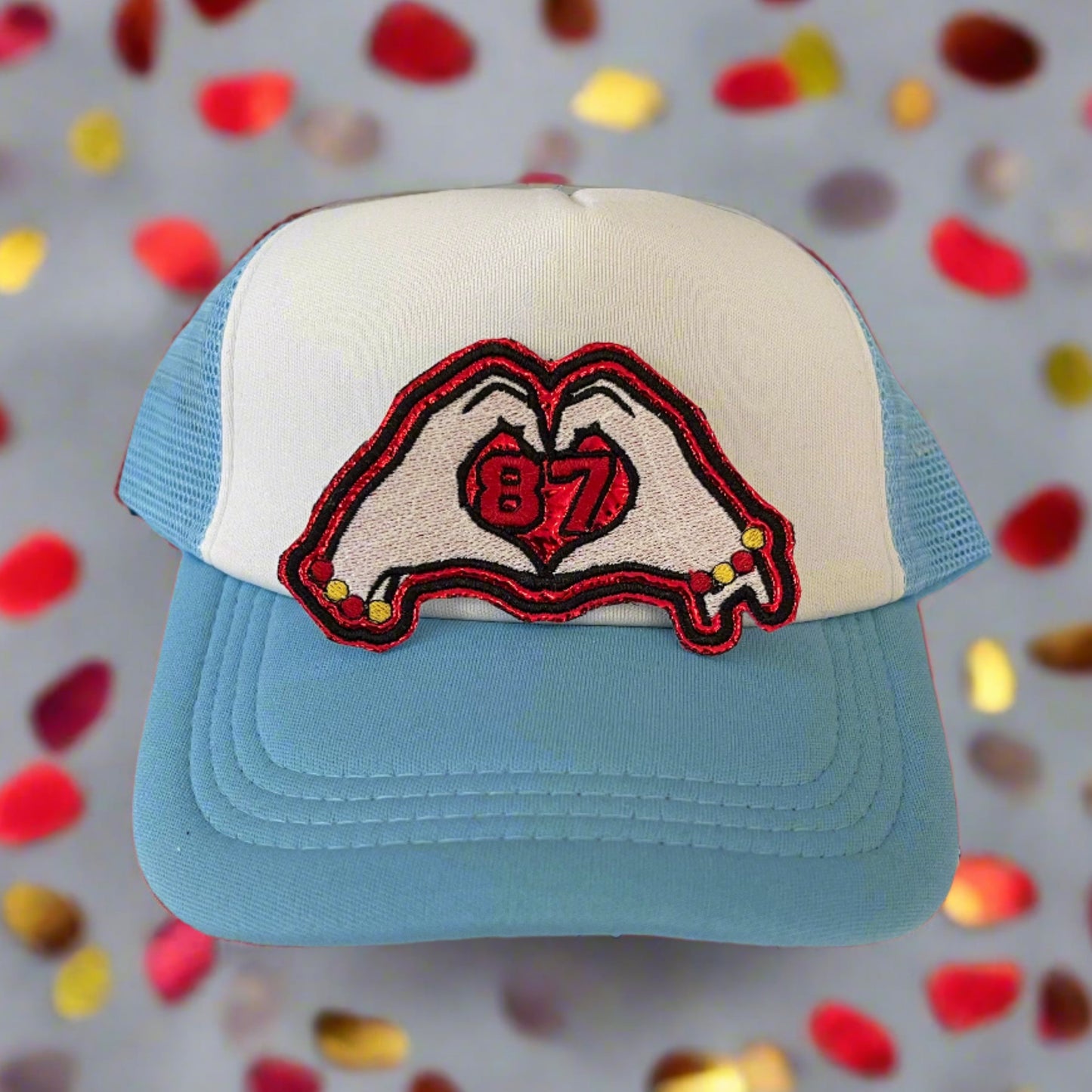 Iron-on patch featuring a heart hands design with the number 87, celebrating Taylor Swift and Travis Kelce, showcasing a stylish and playful aesthetic.