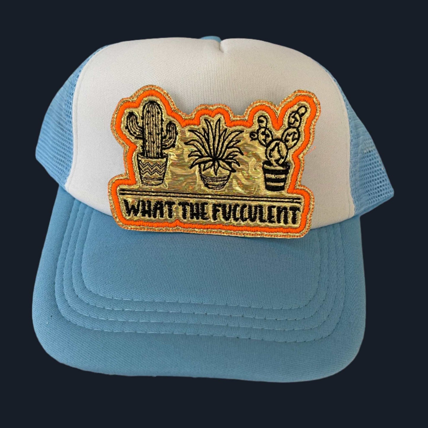 Iron-on patch featuring three black embroidered succulents on a gold background with an orange outline and the text "WHAT THE FUCCULENT" in black.