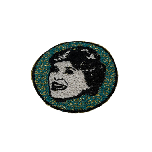 Golden Girls Blanche embroidered patch featuring a retro pop art design with a vibrant teal and gold background, perfect for customizing clothing and accessories.