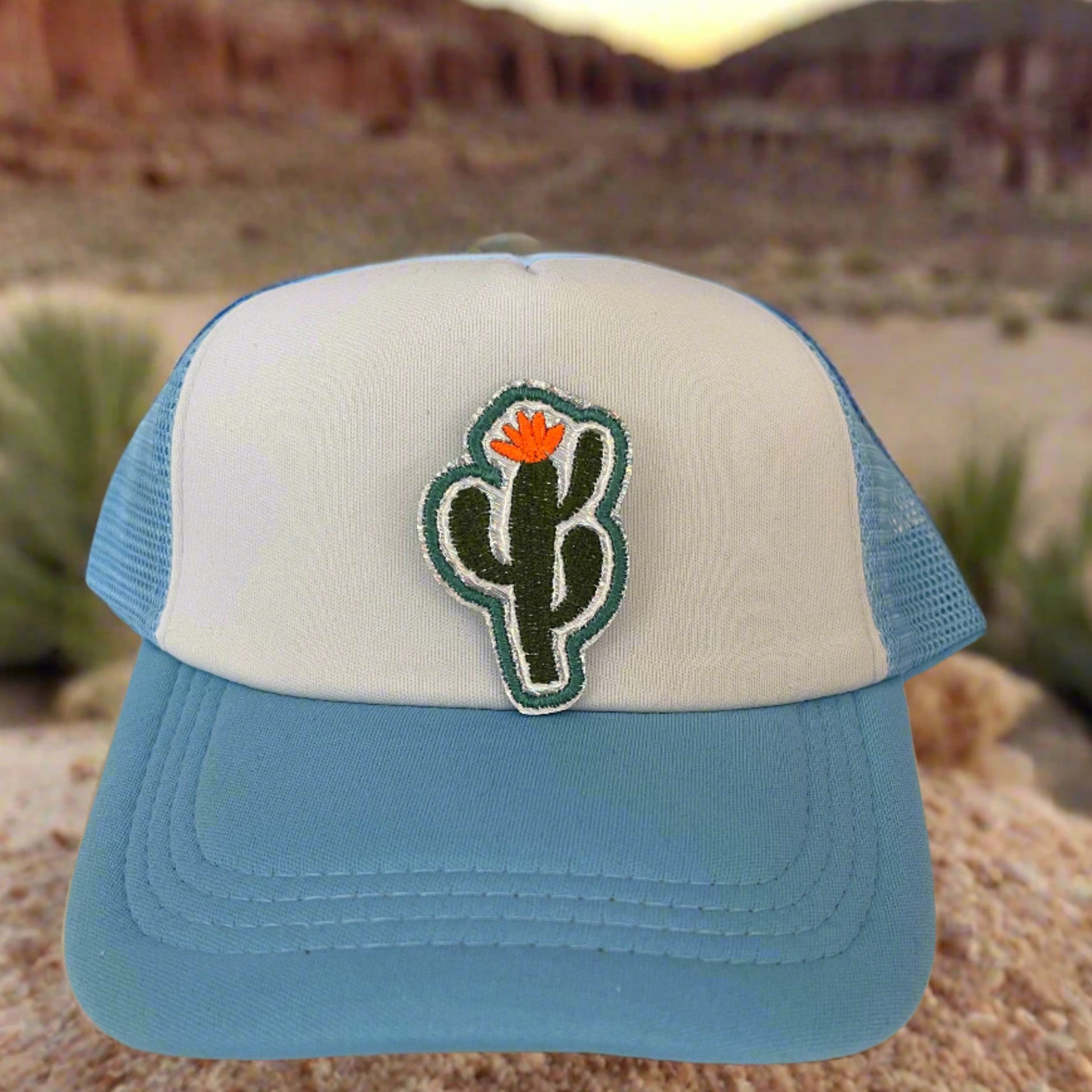 Close-up of a Southwest Style Cactus embroidered patch featuring a green cactus with an orange flower, perfect for customizing hats, apparel, and various accessories.