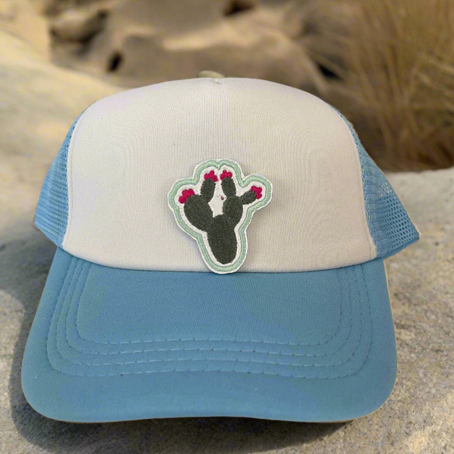Close-up of a Southwest Cactus embroidered patch featuring a green cactus with pink flowers, perfect for customizing hats, apparel, and various accessories.