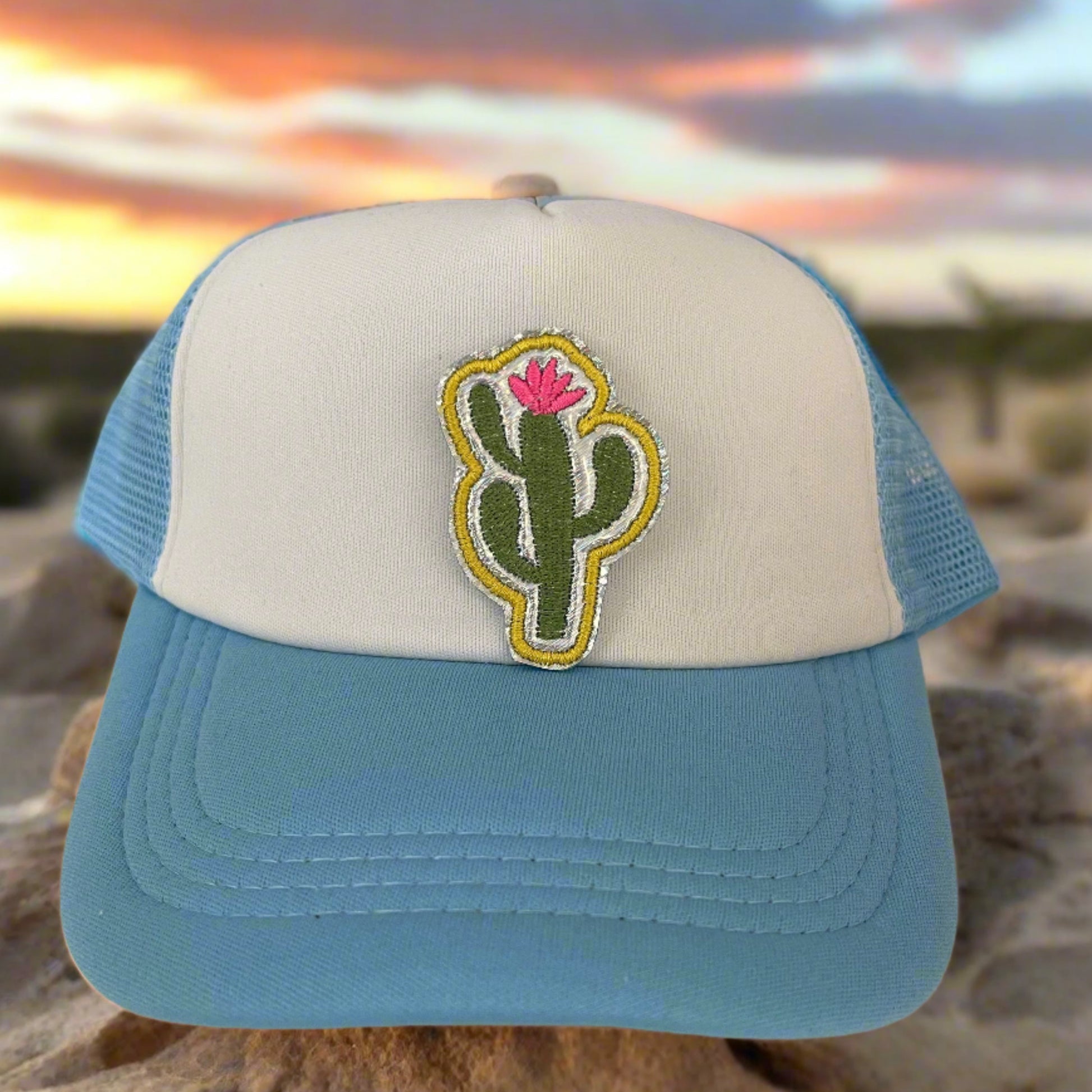 Close-up of a Trendy Cactus embroidered patch featuring a green cactus with a pink flower, perfect for customizing hats, apparel, and various accessories.