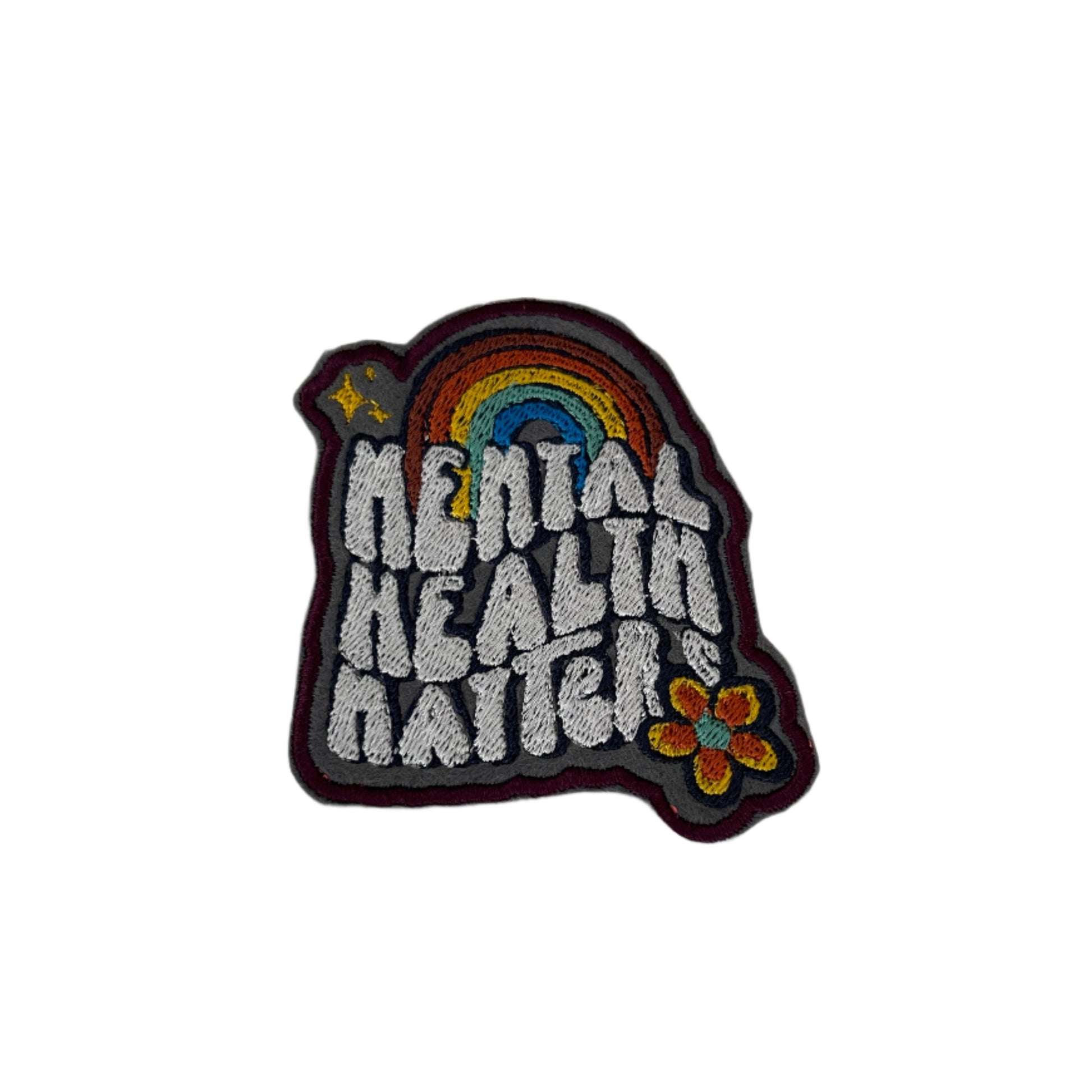 Mental Health Matters embroidered patch featuring a colorful rainbow and whimsical design, perfect for customizing clothing and accessories.