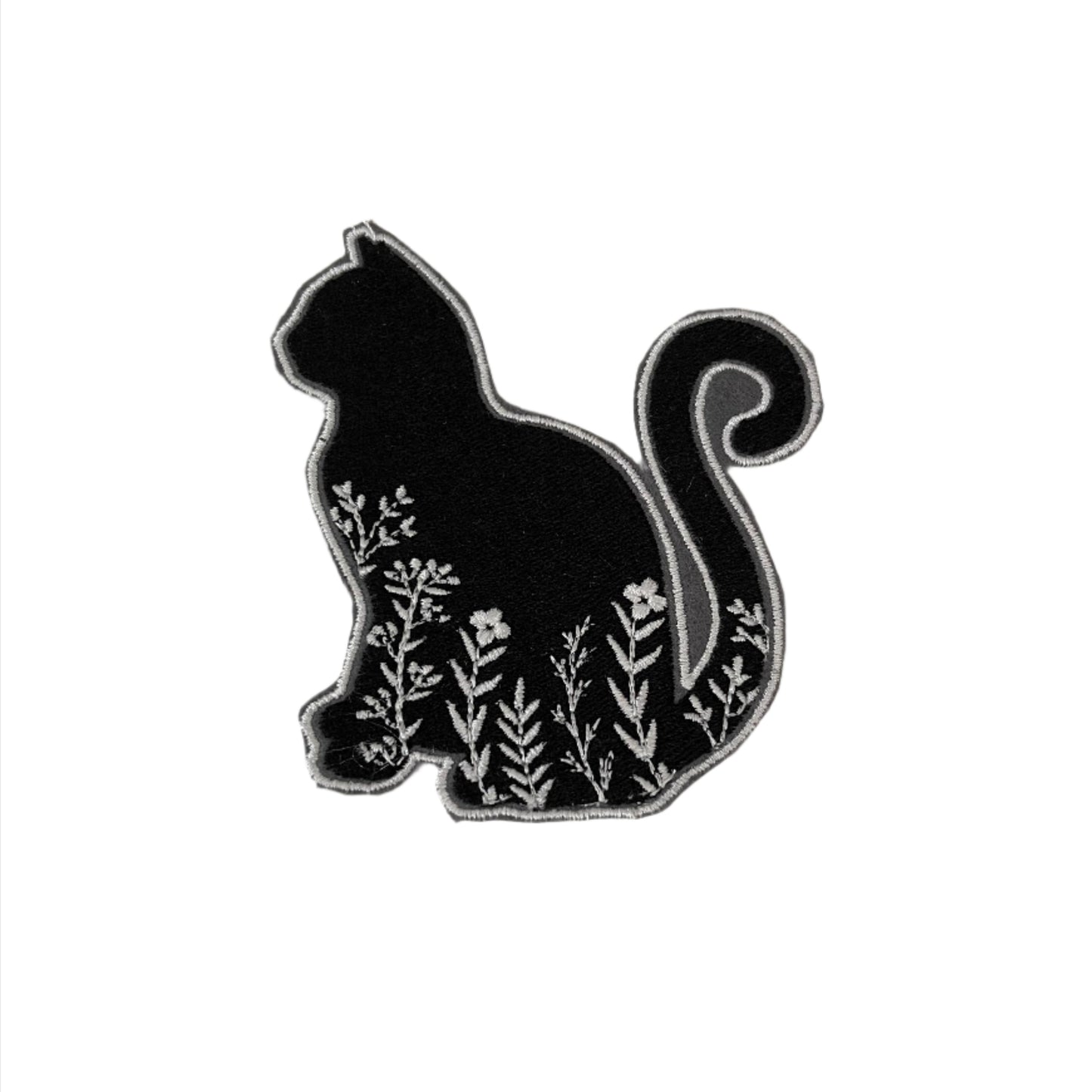 Black cat patch with white floral embroidery, perfect for customizing clothing and accessories.