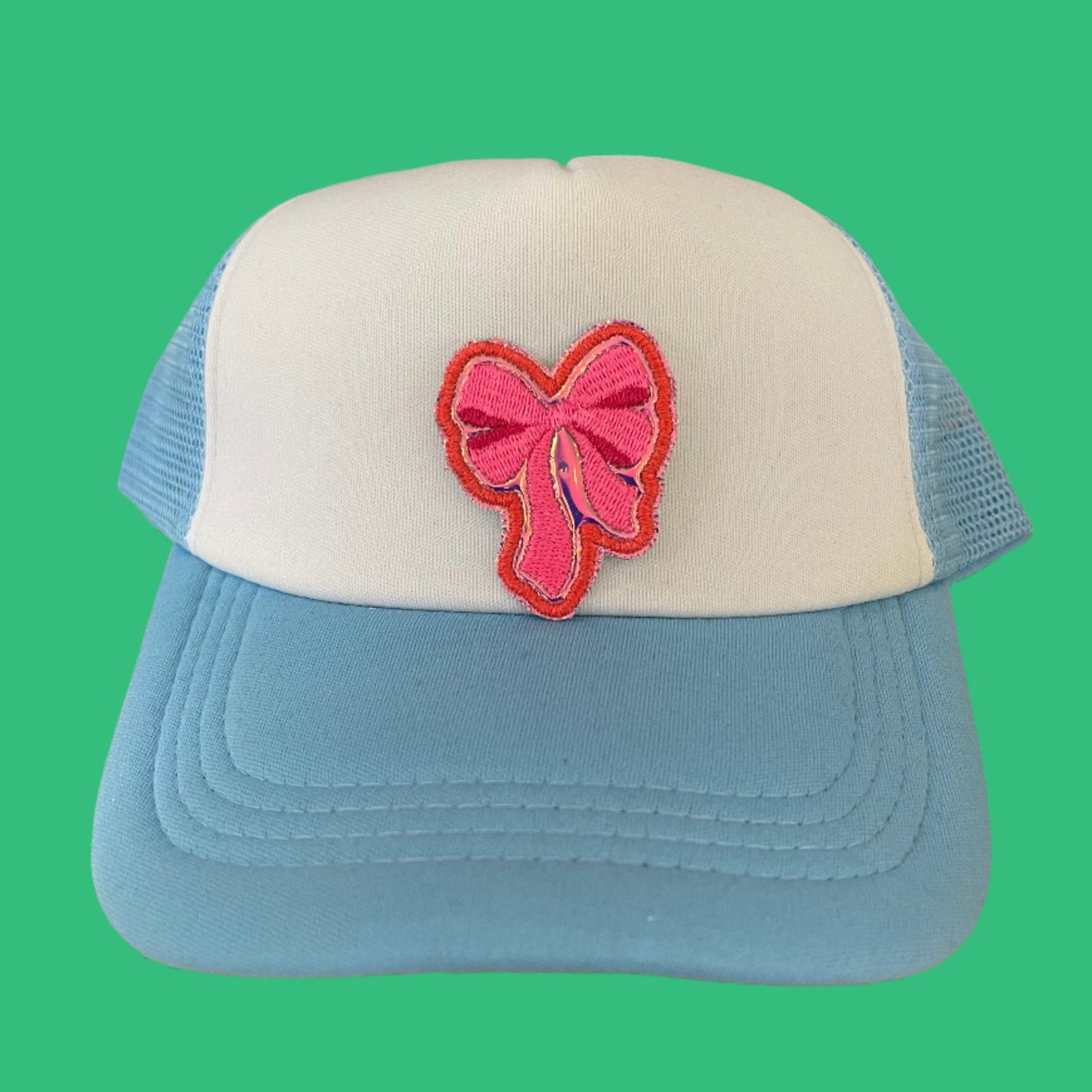 Vibrant pink bow embroidered patch, perfect for adding a trendy and stylish touch to various accessories.