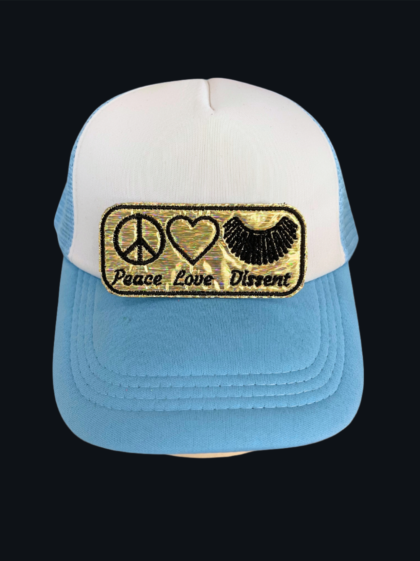 Handmade Peace, Love, Dissent patch with peace sign, heart, and dissent text on a gold background.