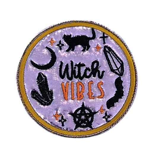 Custom embroidered patch with the text "Witch Vibes" featuring mystical symbols like a black cat, moon, and crystals, perfect for personalizing hats and apparel.