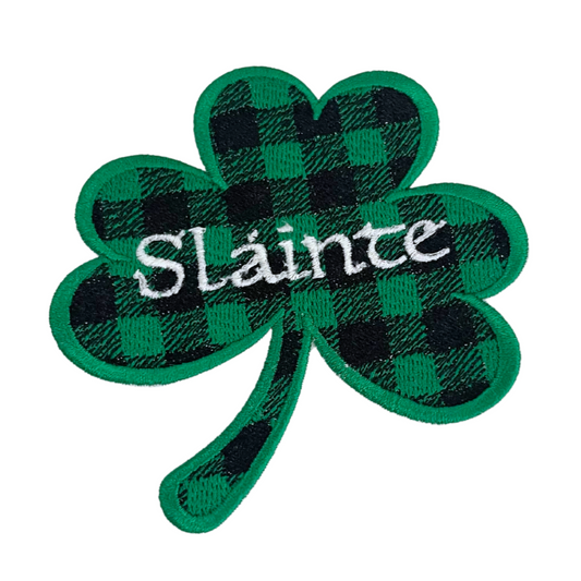 Handmade Sláinte Shamrock patch with green plaid design and white script embroidery.