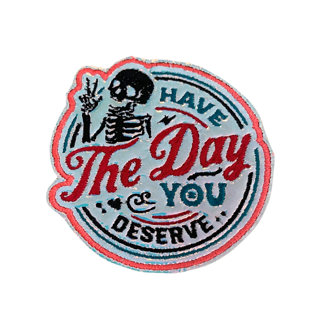 Handmade "Have the Day You Deserve" skeleton patch with vibrant colors and intricate embroidery.