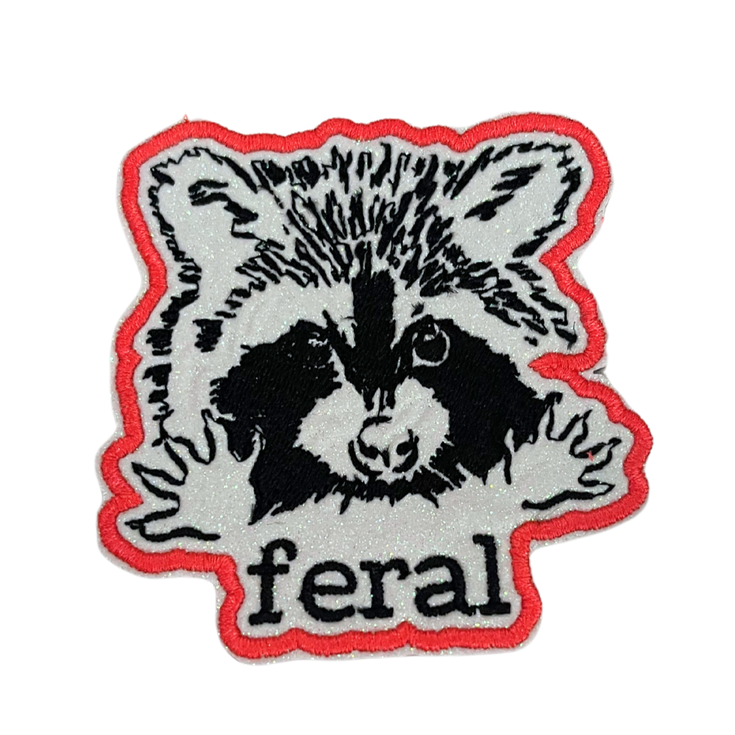 Custom embroidered "feral" raccoon patch with a fierce raccoon design.