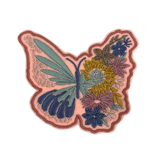 Handmade Butterfly and Floral patch with intricate embroidery on a white background.