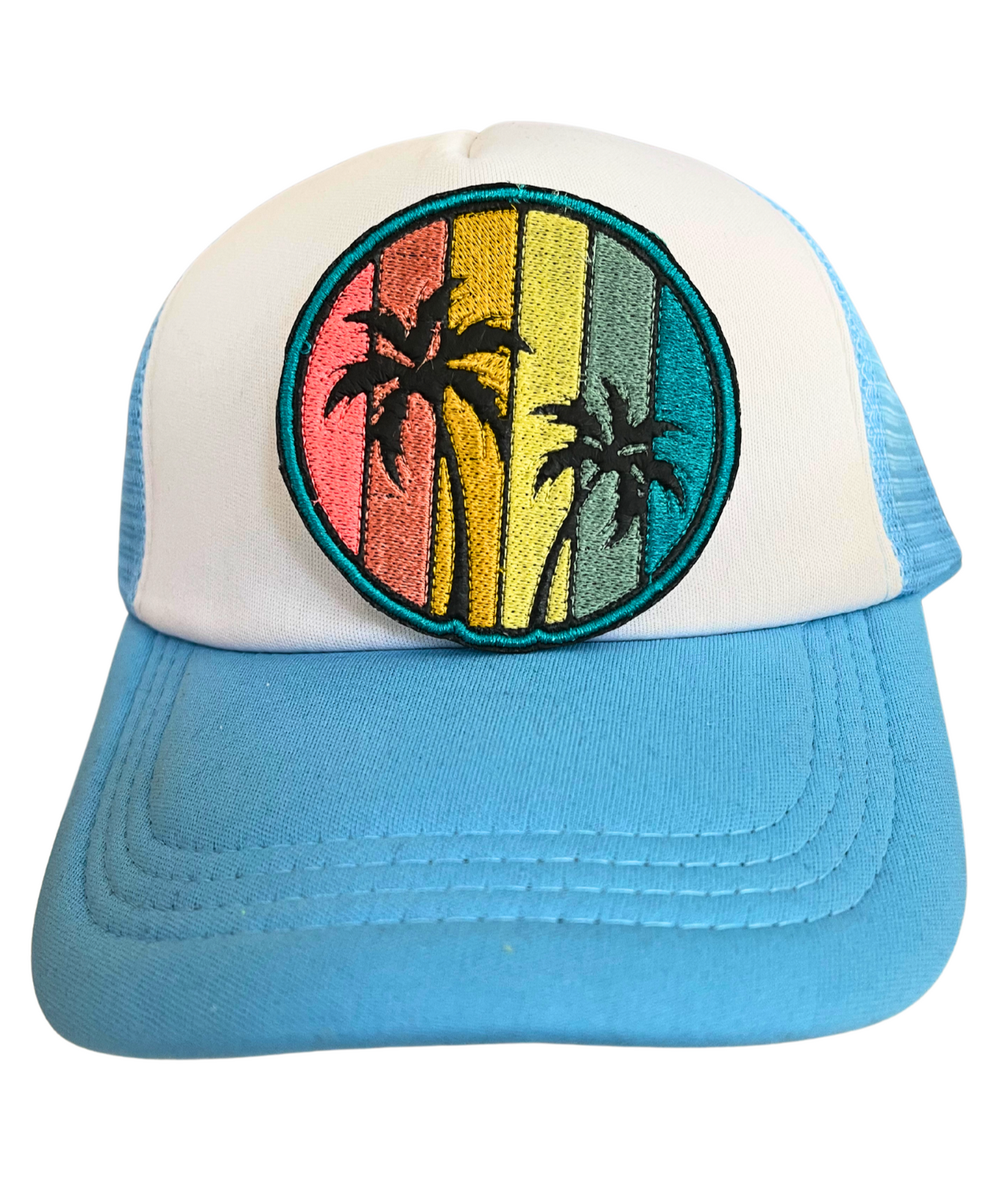 Round patch with a retro sunset background and black palm trees