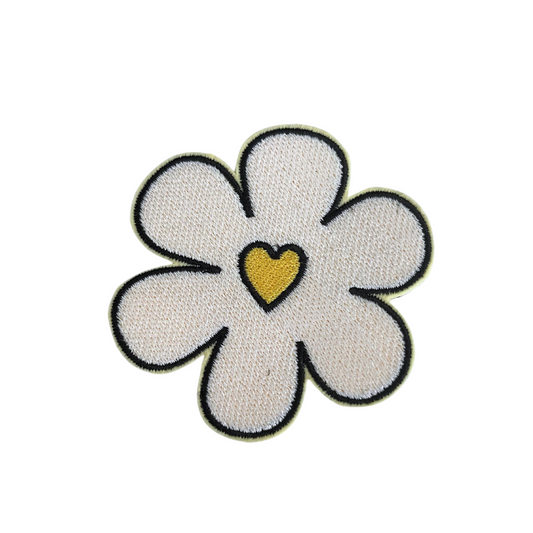 Close-up of a handmade retro flower heart patch with a yellow heart center.