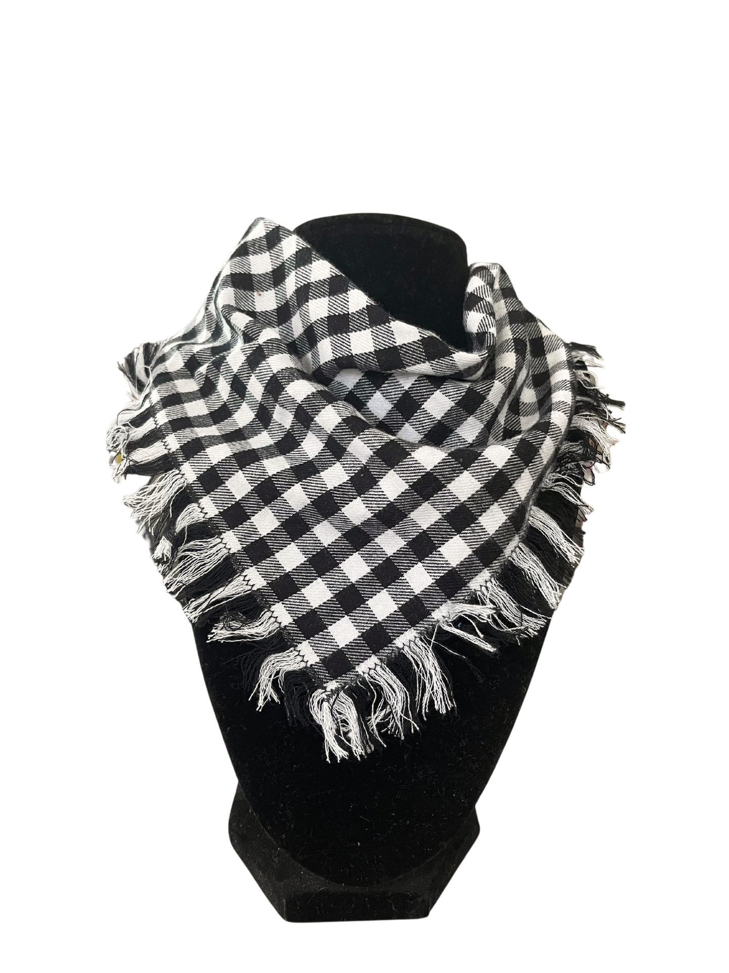 Black and white gingham fringe bib-dana scarf with adjustable snap closures, displayed on a black mannequin.