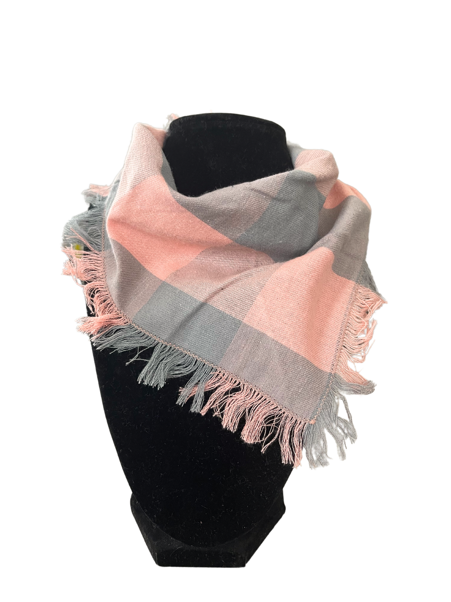 Pink and gray plaid fringe bib-dana scarf with adjustable snap closures, displayed on a black mannequin.