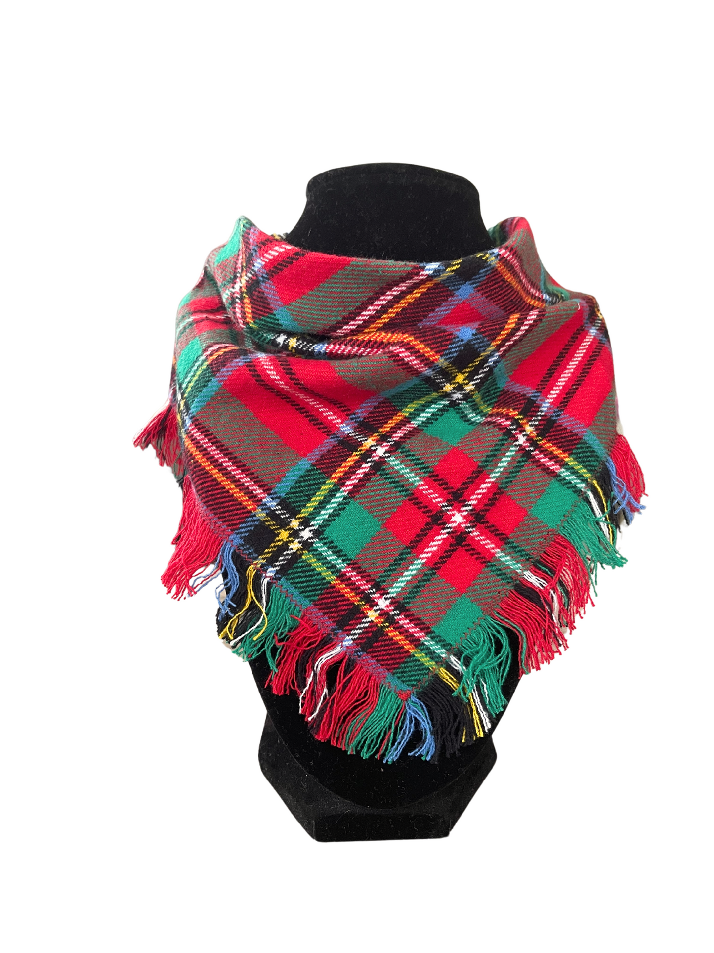 Red plaid fringe bib-dana scarf with green, yellow, blue, and white accents, featuring adjustable snap closures, displayed on a black mannequin.