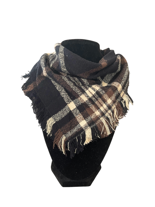 Classic brown plaid fringe bib-dana scarf with shades of brown, cream, and black, featuring adjustable snap closures, displayed on a black mannequin.