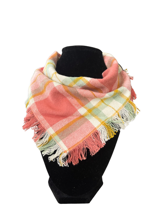 Pastel plaid fringe bib-dana scarf with shades of peach, yellow, mint green, and white, featuring adjustable snap closures, displayed on a black mannequin.