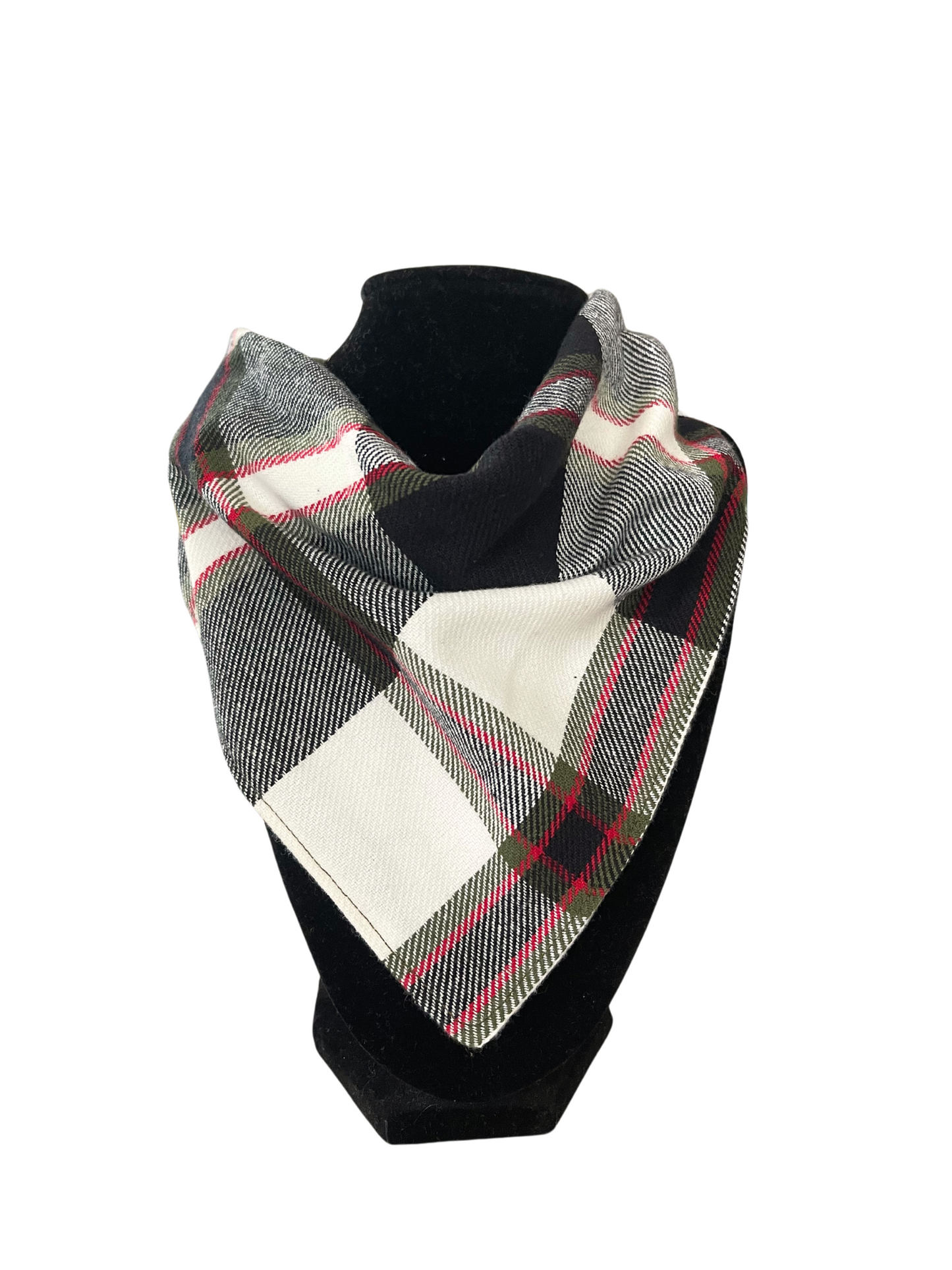 Reversible bib-dana with a classic plaid pattern in black, cream, and red on one side and solid color cotton flannel on the reverse, displayed on a black mannequin.