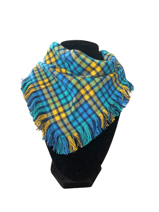 Vibrant plaid fringe bib-dana scarf for babies and toddlers in blue and yellow with adjustable snap closure.