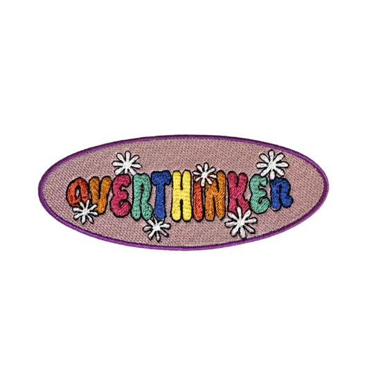 Overthinker patch with retro lettering and daisy accents.

