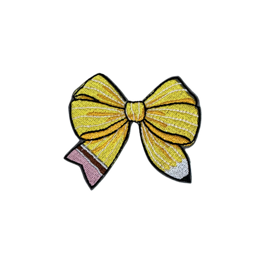 Pencil bow patch with yellow, pink, and black details, perfect for back-to-school themes.

