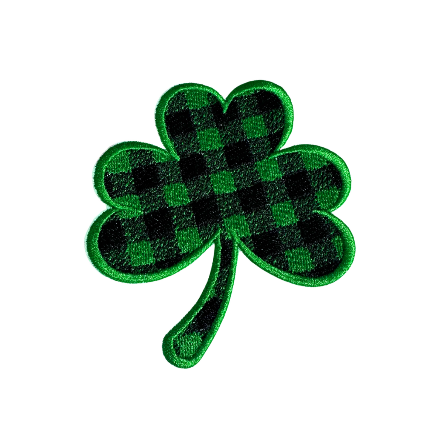 Buffalo plaid shamrock patch in green and black.

