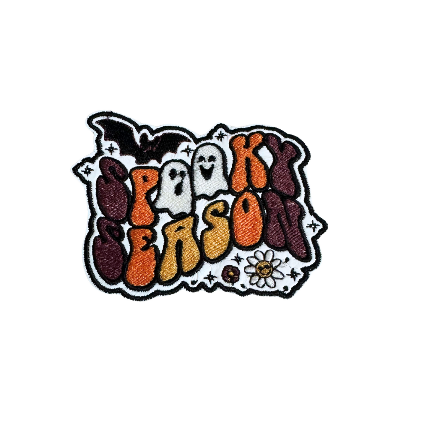 Retro Halloween patch with "Spooky Season" text, featuring ghosts, a bat, and a daisy.

