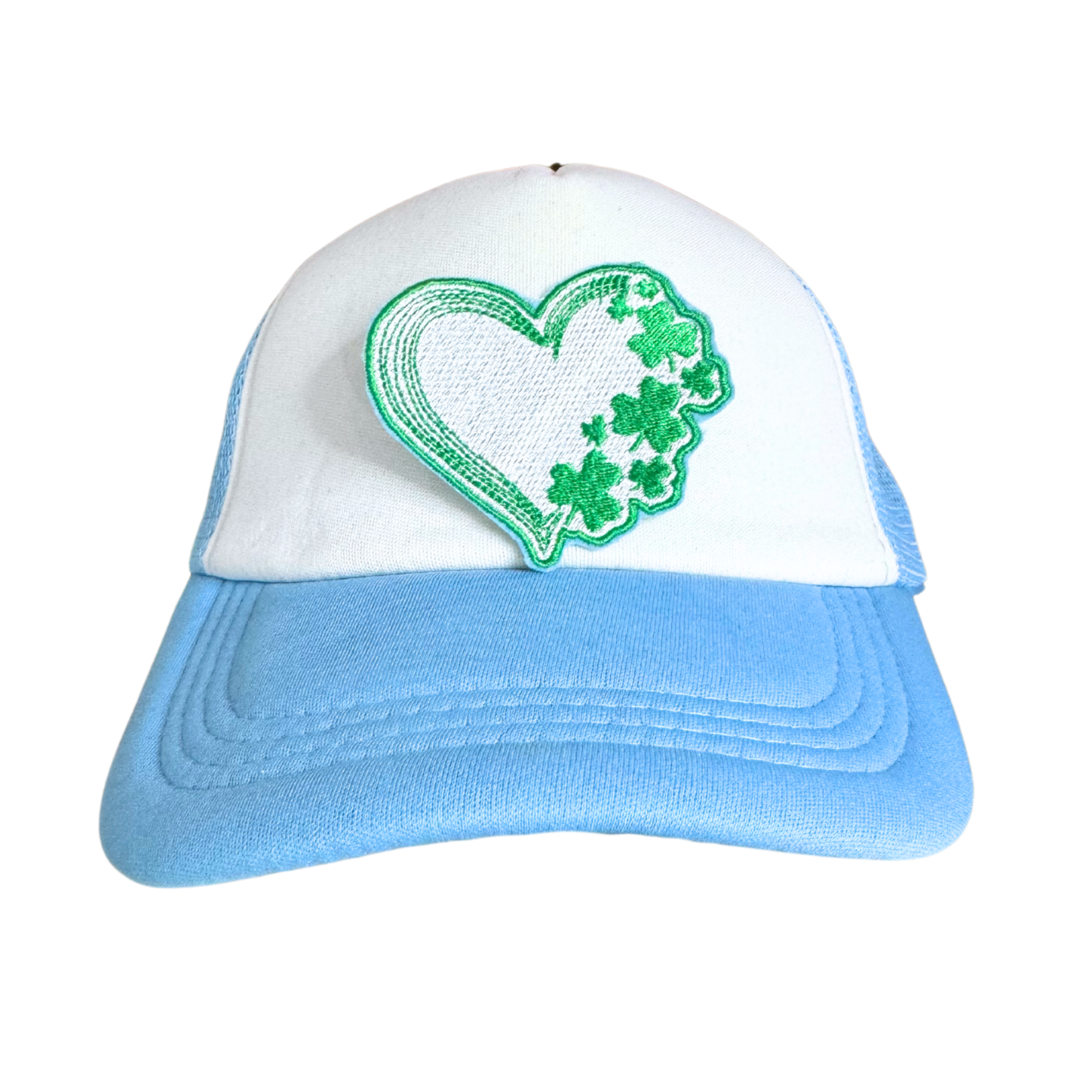 Heart-shaped patch with shamrock design in green and white.

