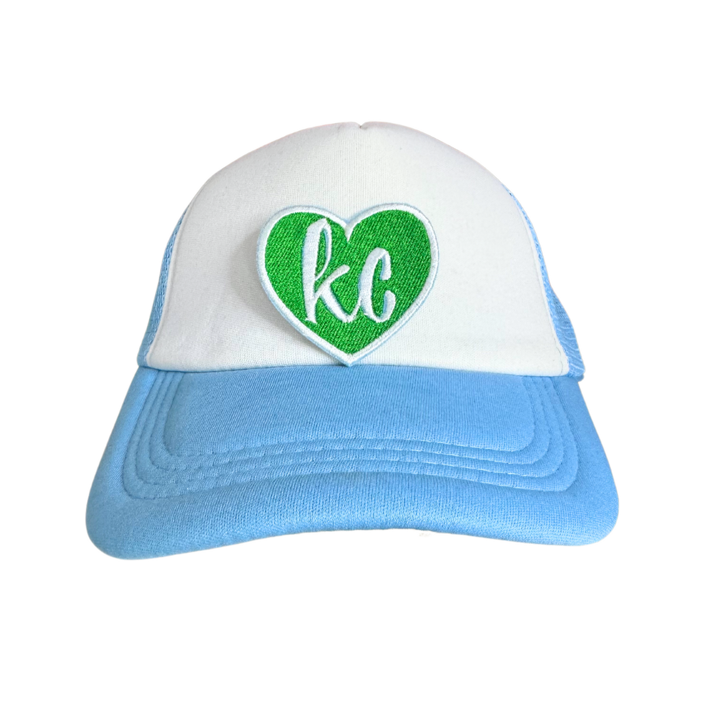 Green heart patch with white "KC" lettering.

