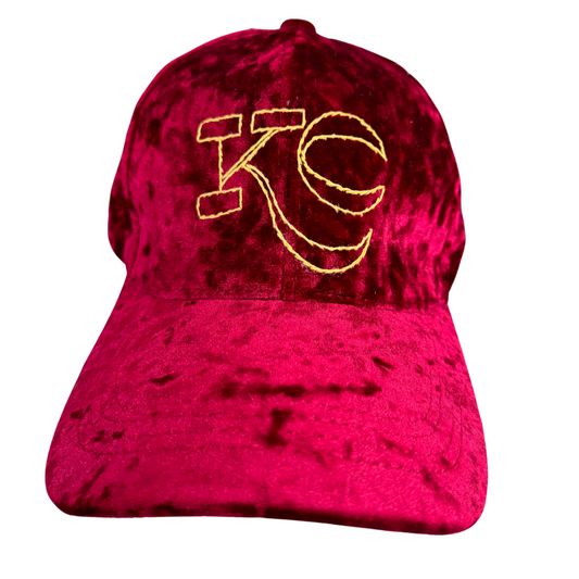 Burgundy velvet KC hat with hand-embroidered gold KC logo.