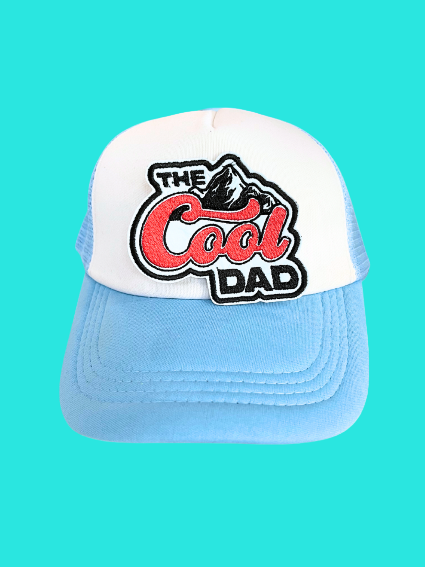 Handmade The Cool Dad patch with bold colors and a mountain design.