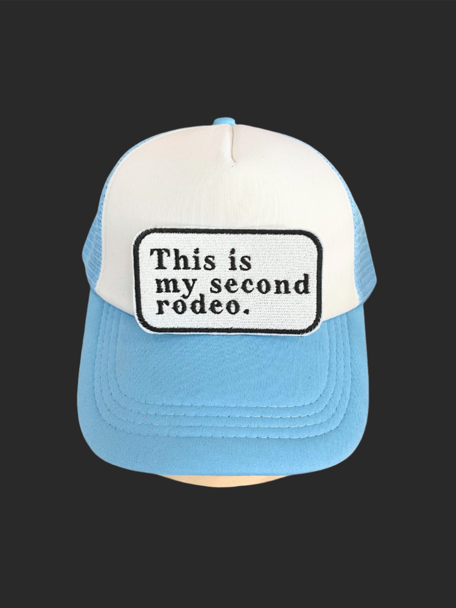 Custom embroidered patch with the text "This is my second rodeo," perfect for personalizing hats and apparel.