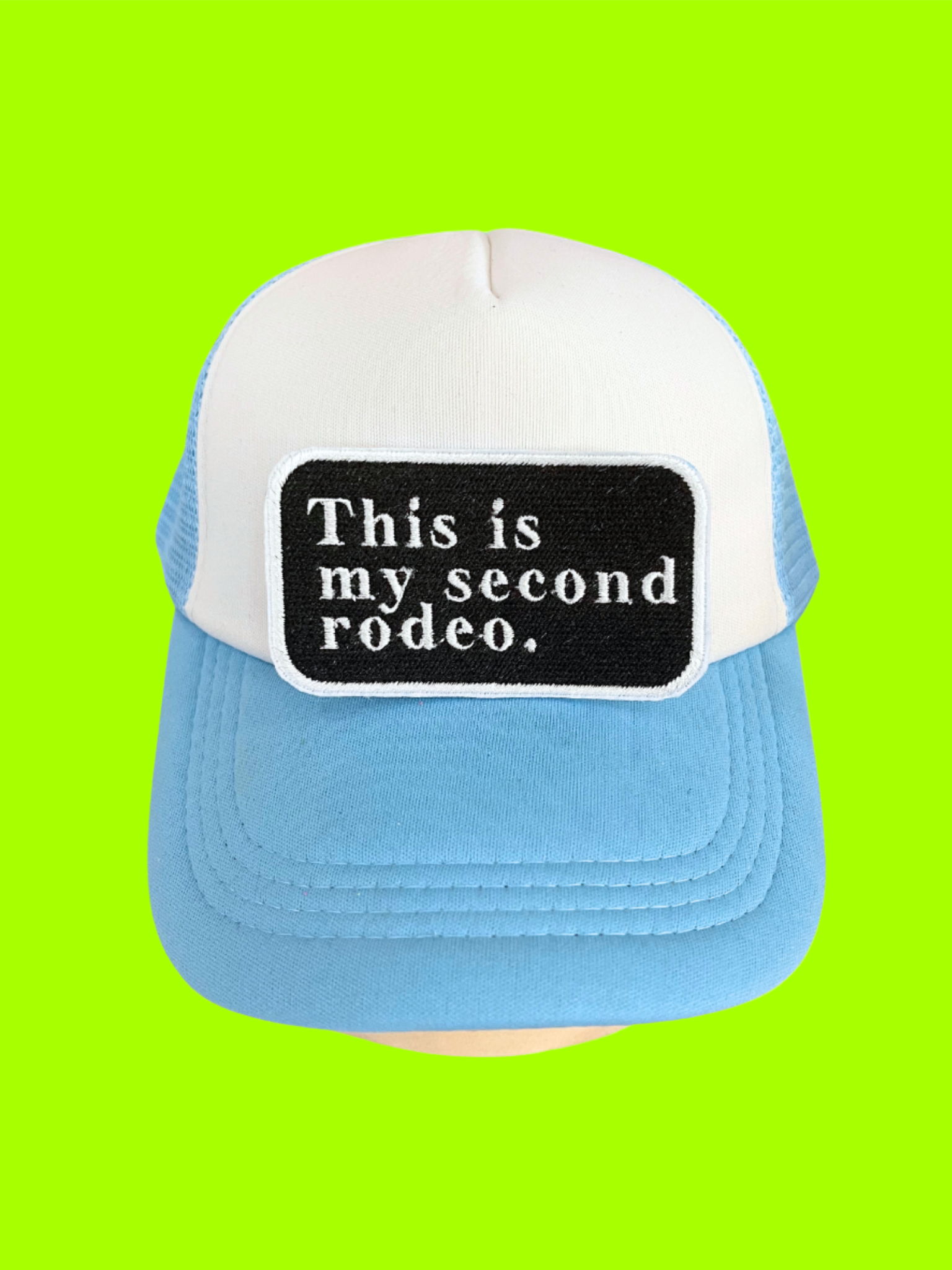 Custom embroidered patch with the text "This is my second rodeo," perfect for personalizing hats and apparel.