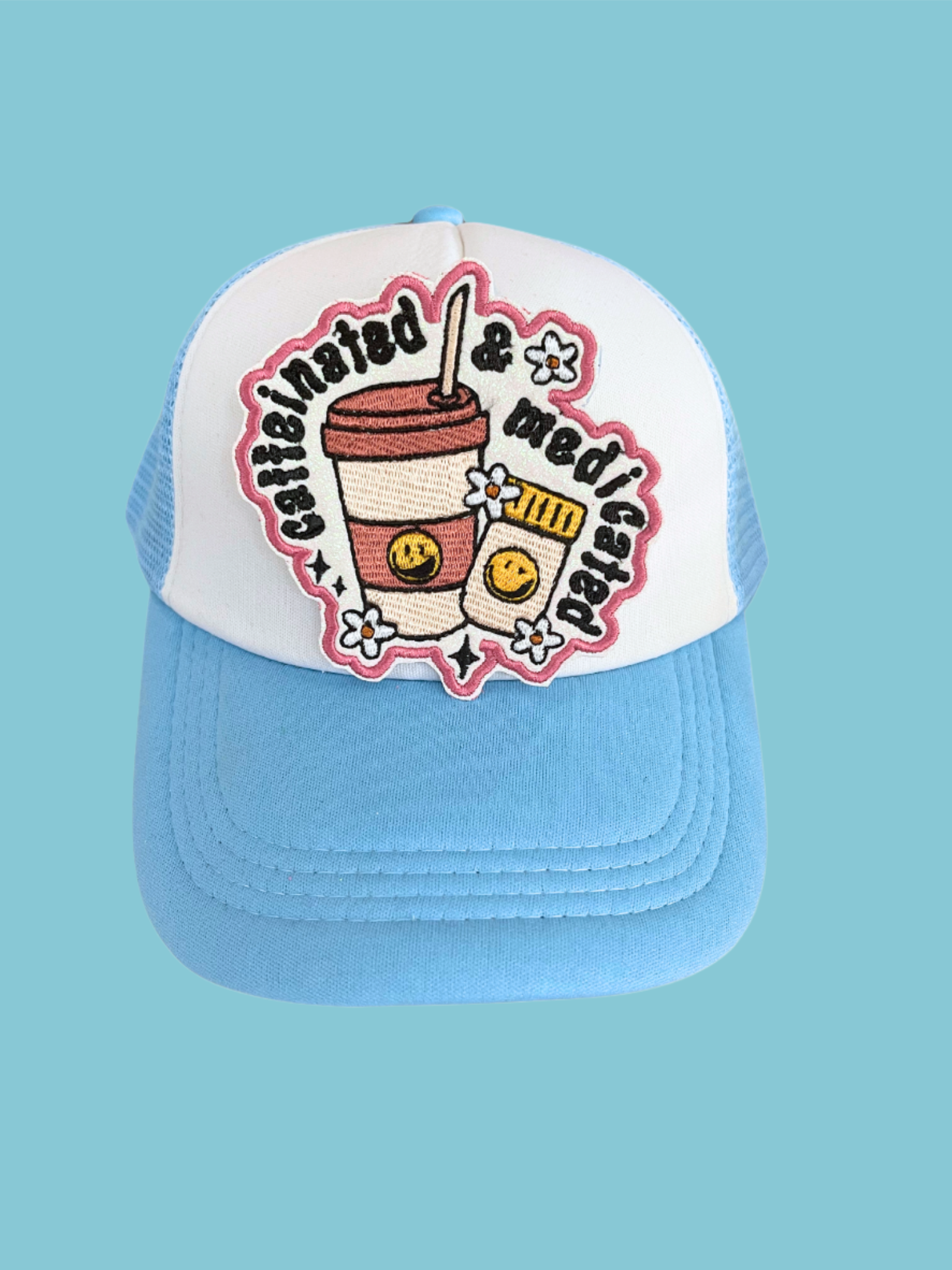 Custom embroidered patch with the text "Caffeinated & Medicated" featuring a coffee cup and pill bottle design, perfect for personalizing hats and apparel.