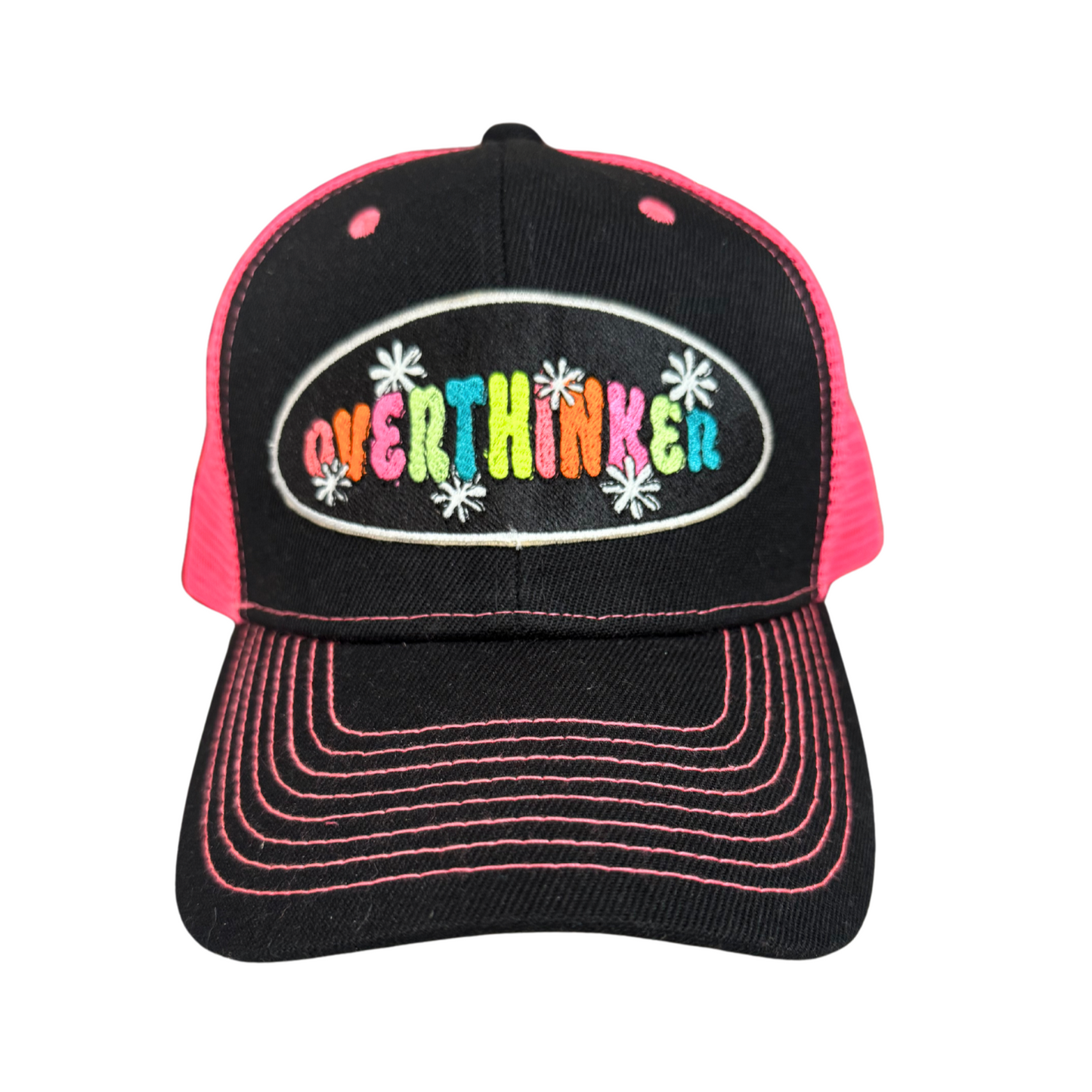 "Overthinker" embroidered patch in vibrant colors on a black and pink trucker hat.

