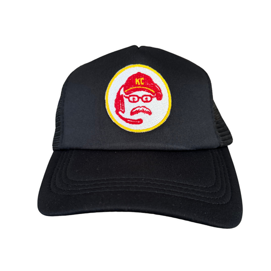 Front view of a black trucker hat featuring an embroidered patch of Kansas City Chiefs Coach Andy Reid's face with a headset and cap.

