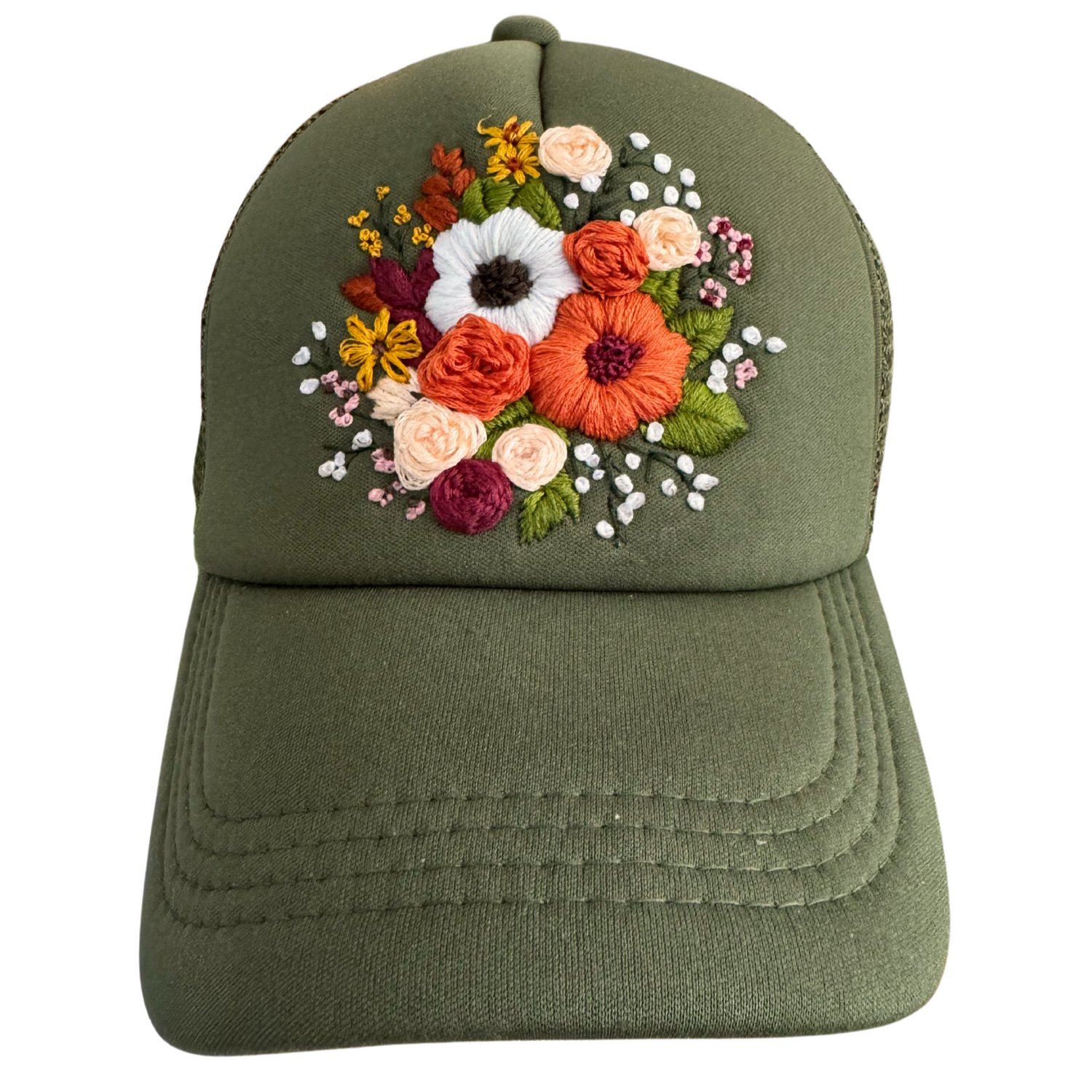 Hand-embroidered floral bouquet design on olive green hat.

