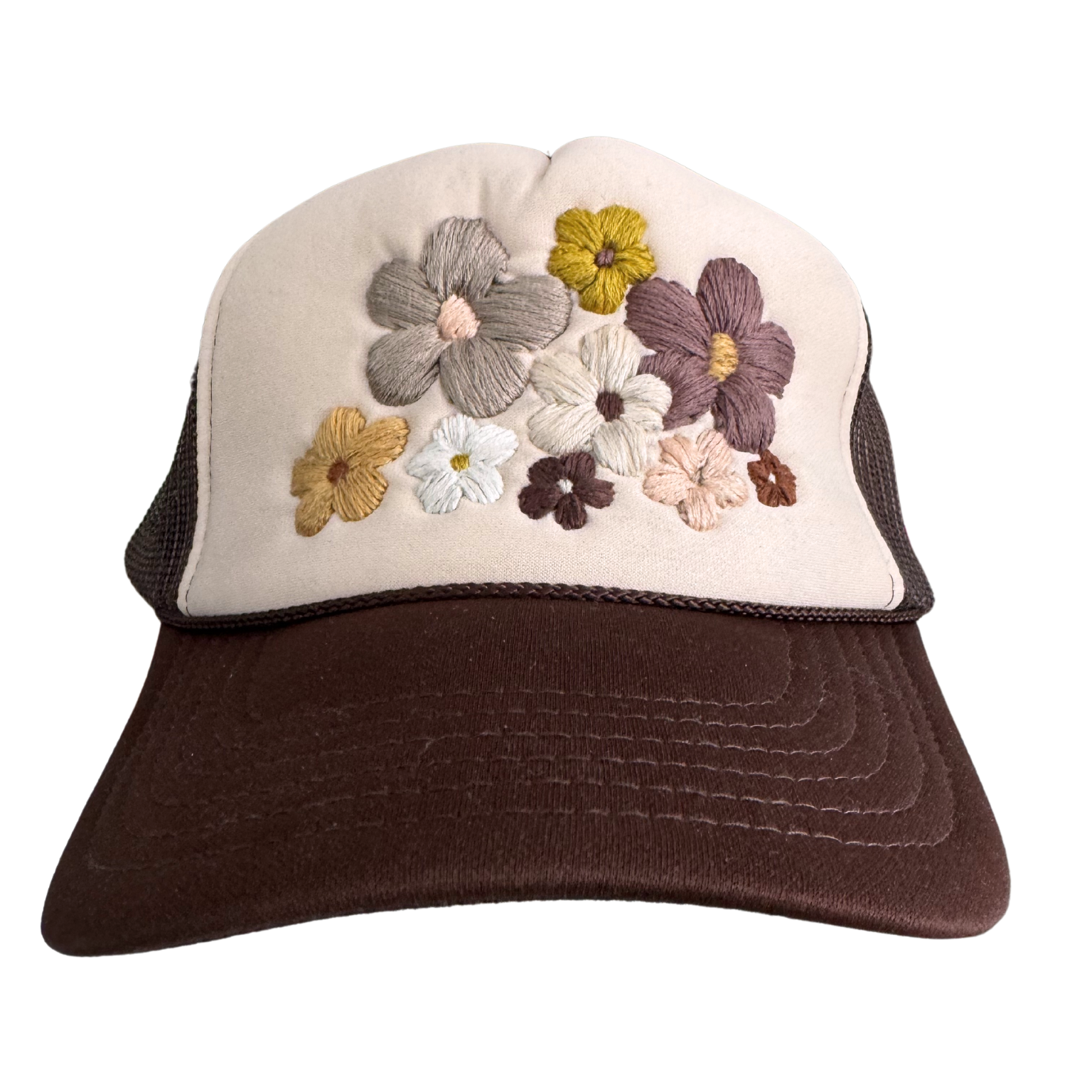 Brown and beige floral trucker hat with hand-embroidered neutral flowers.