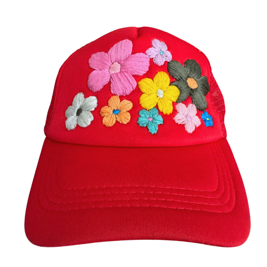 Hand-embroidered colorful flowers on red hat.

