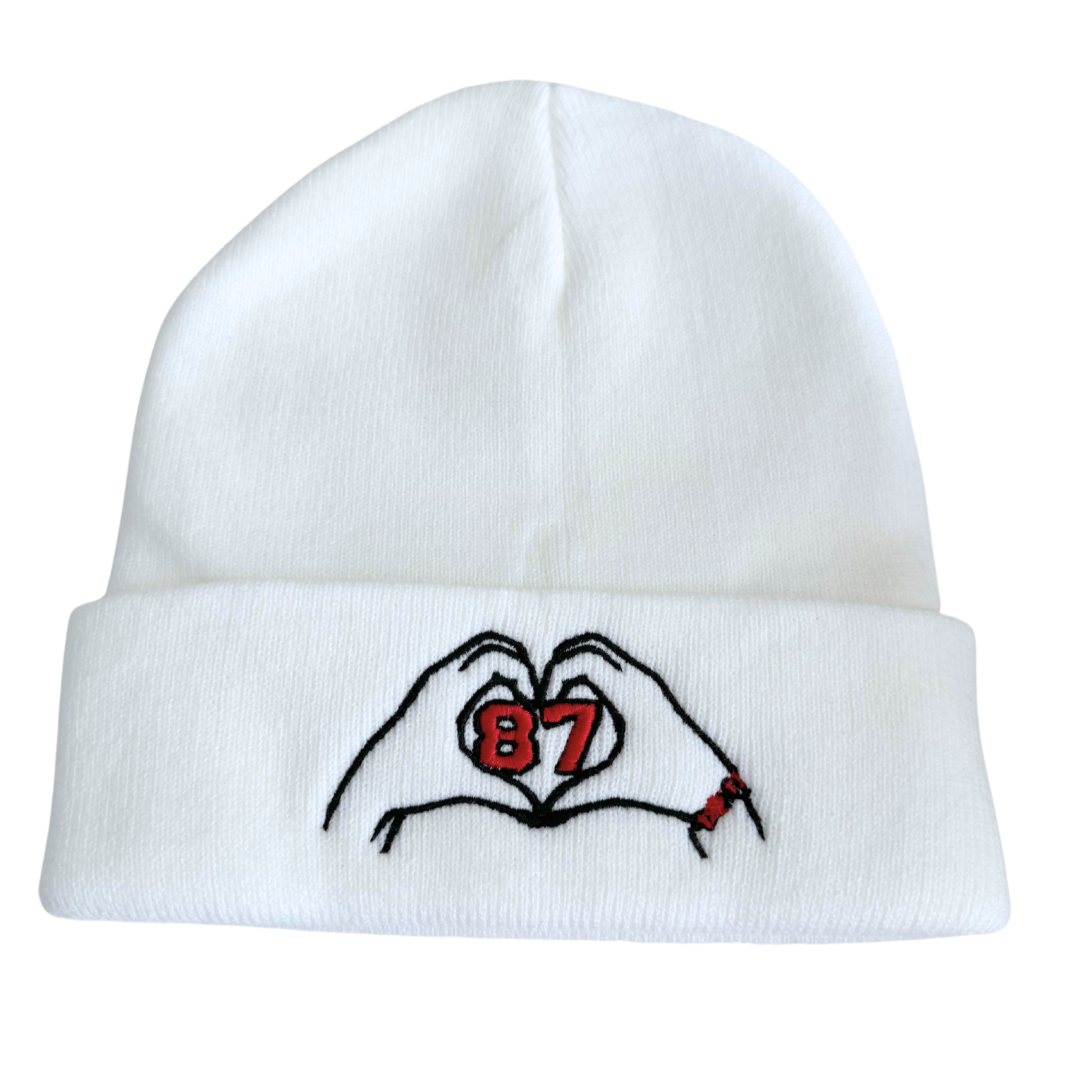 White beanie with embroidered heart hands and “87” design inspired by Travis Kelce and Taylor Swift.

