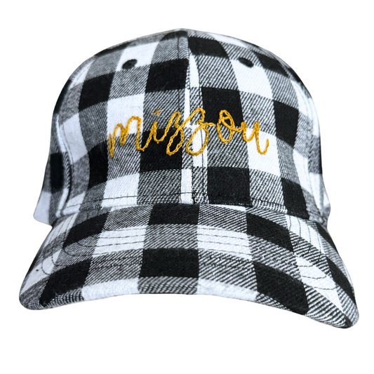 Hand-embroidered "Mizzou" design on black and white plaid hat.

