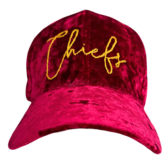 Hand-embroidered "Chiefs" design on red velvet hat.

