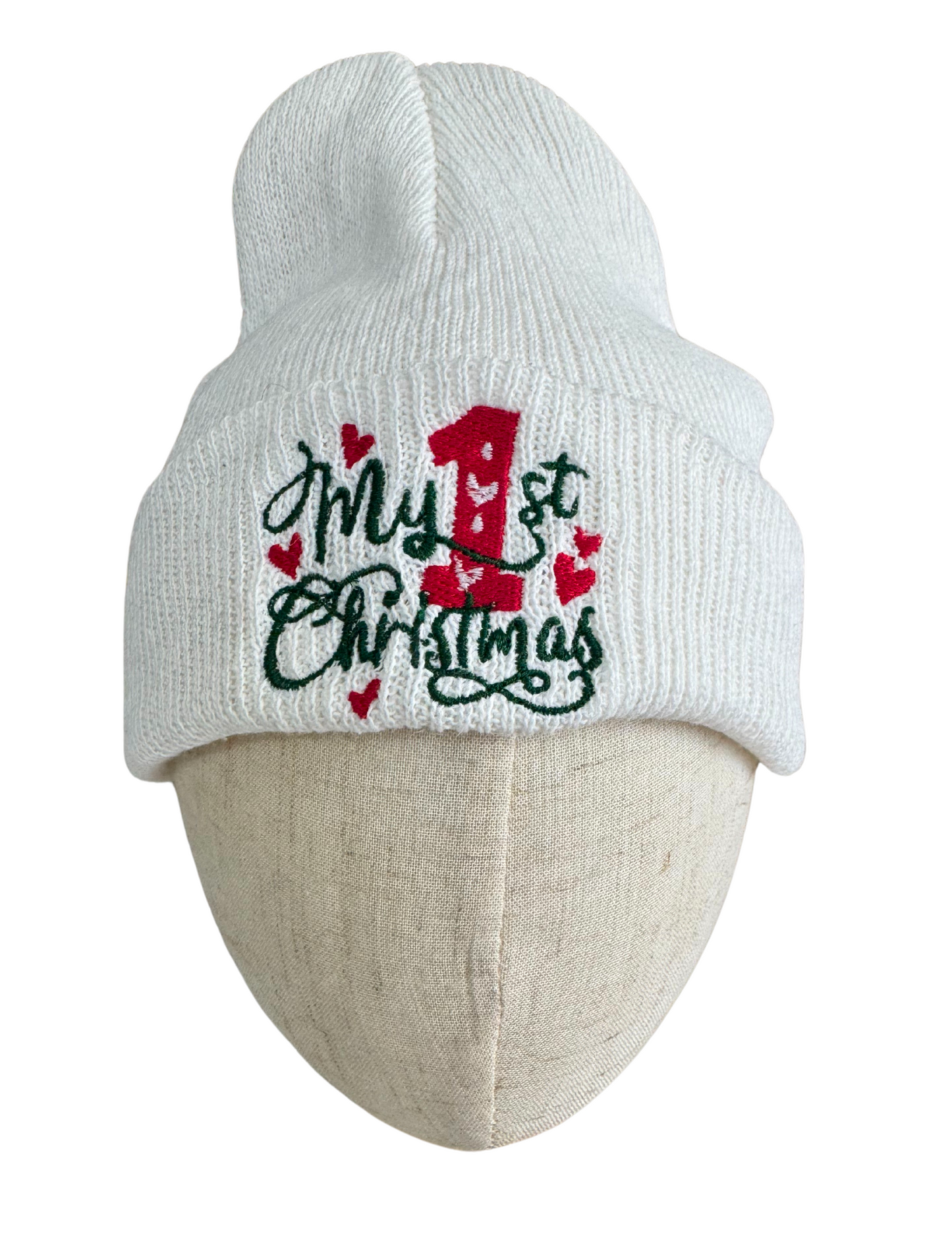 White Christmas baby beanie with "My 1st Christmas" embroidery and red hearts.